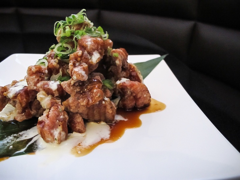 Chicken Kara Age - Classic Japanese fried chicken in Teriyaki sauce and Wasabi sour cream topped with scallions - Katana