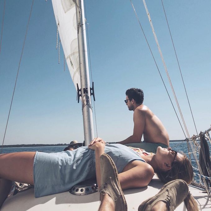 Lucas Young, Soaking up some sun on my family’s sailboat after a long day on the computer, nice to unwind on the lake.