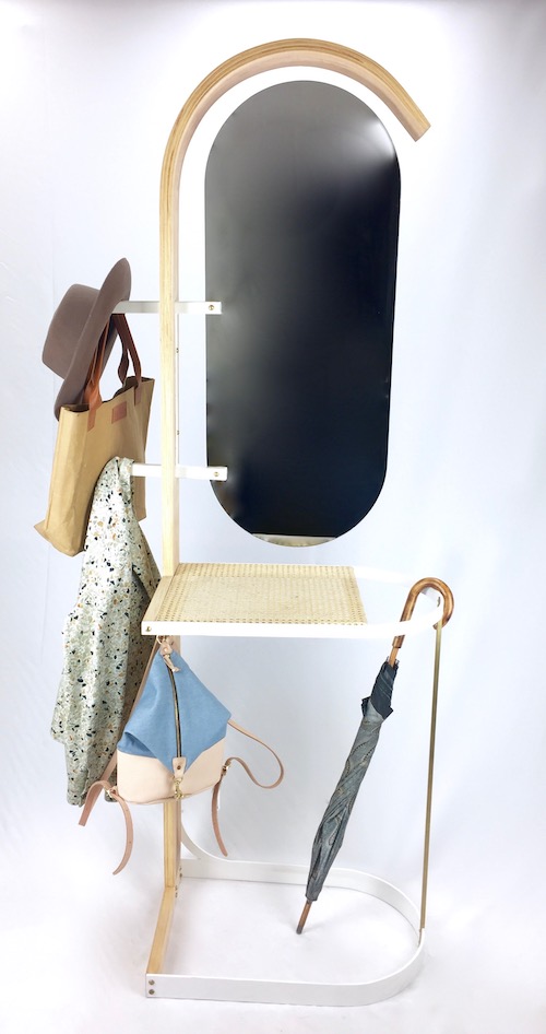 This modern take on the valet stand is the ideal piece of furniture for the bedroom or front hall to keep your daily essentials organized. The bent maple frame accentuates the near full body mirror. There is space to place bags, coats and umbrellas and the woven cane surface provide a place to keep your keys, wallet and phone. The product was designed to ship flat and assemble in minutes with one screwdriver.