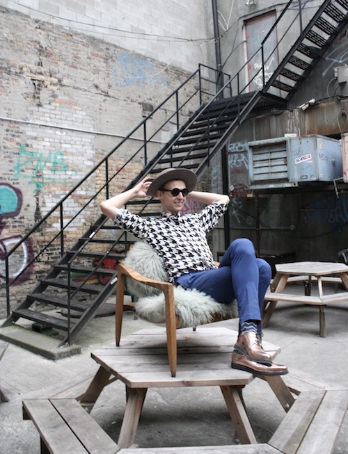 Soaking up some summer rays behind the studio on College street, Thomas lounges in a vintage inspired chair he made and upholstered in Mongolian sheep wool. 