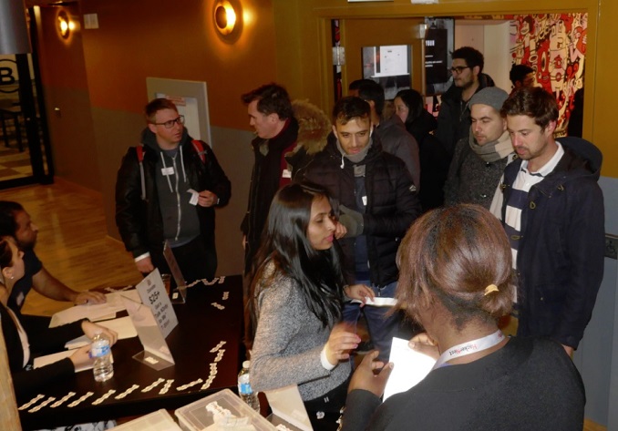 guests entering and donating at the door to HackerNest in Toronto