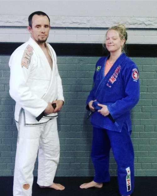 Dawn receiving her blue belt in Brazilian Jiu-Jitsu (eyes closed and all!)