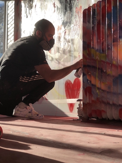 Anthony Ricciardi Paiting a Mural