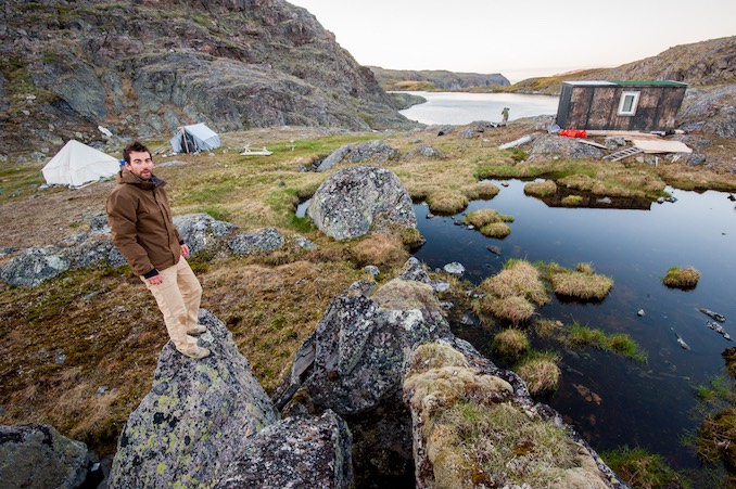 Neil Ever Osborne in the field on assignment in Gwaii Haanas, atop Mount Yatza in British Columbia.