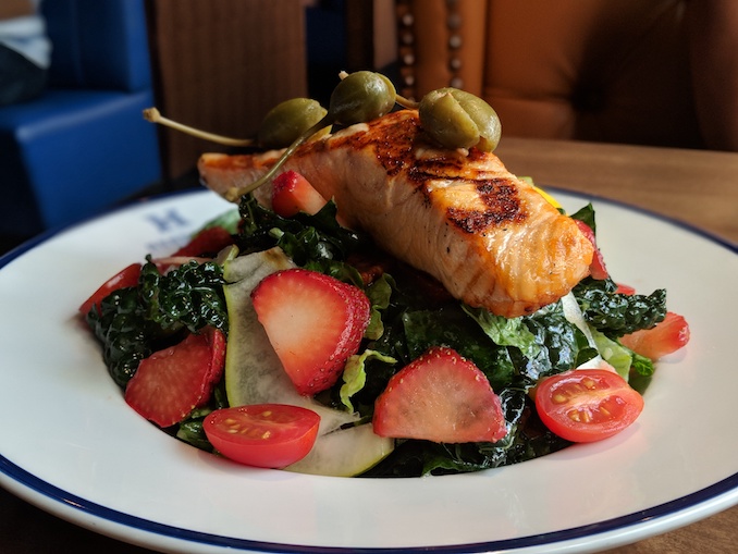 Salmon & Strawberry Salad: crisp romaine, emerald kale, pear, candied pecans, caperberries, champagne vinaigrette