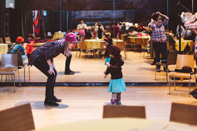 Playing with a fellow clown at a Winter Waves Festival event. Photo by Lauren Kolyn. 