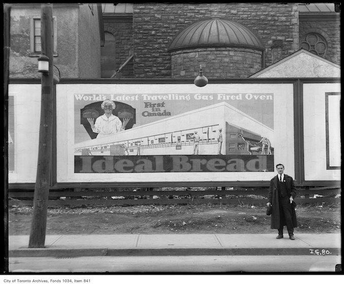 1923 - Billboard advertising Ideal Bread showing artists conception of the first gas-fired traveling oven in Canada