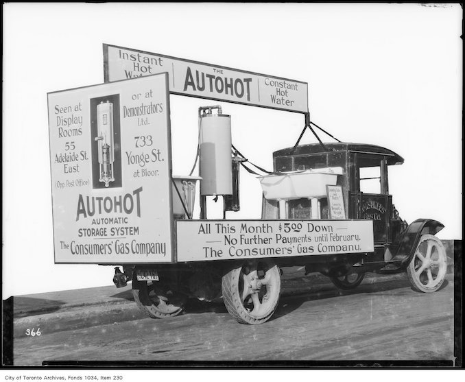 1926 - Ruud Autohot gas water heater and tank displayed on a truck