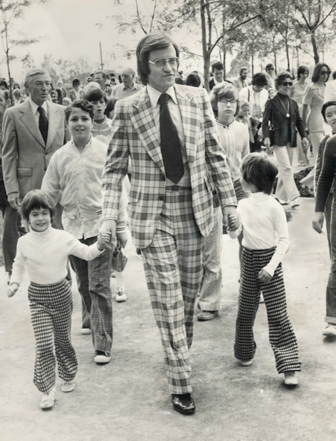 1974 - Metro Chairman Paul Godfrey with 4-year-old Jennifer Grant and her sister Catherine, 6, in crowd of up to 10,000 children and their parents enjoying a sneak preview