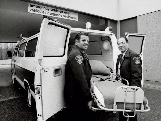 1980 - Ron Bull - Ambulance driver Henry Laurin (left) and attendant Ike Campbell, who spared no horses on the Adair mercy dash, making the 90 miles from Midland to Toronto's Hospital for Sick Children in 79 minutes