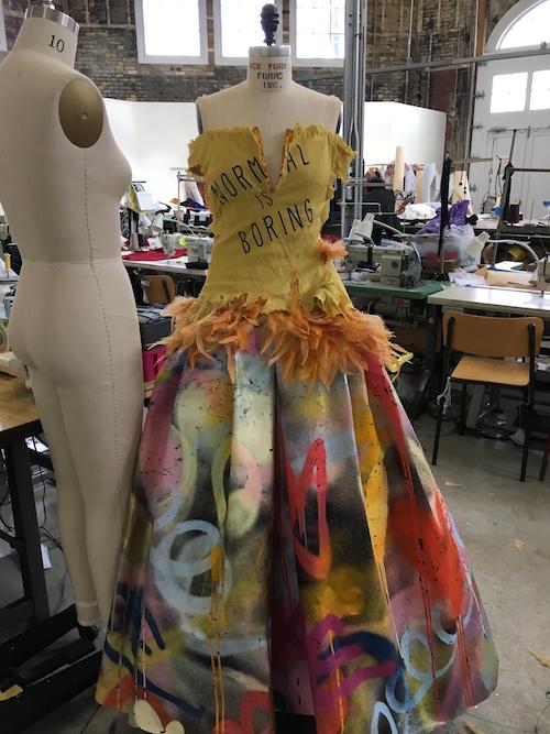 Using Anthony Ricciardi’s spray painting, and incorporating it into a gown for Ann Kaplan Mulholland.