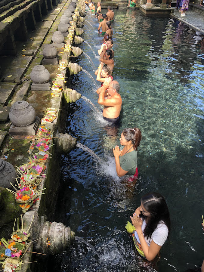 Toronto Noriko Oyama LUXFINDZ - Tirta Empul Holy Water Temple participating in the ritual bathing ceremony.