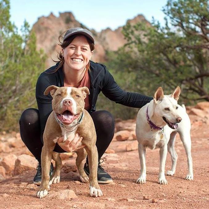 Kelly and her rescued dogs Bubs (left) and Moonoi hiking in Colorado Springs.