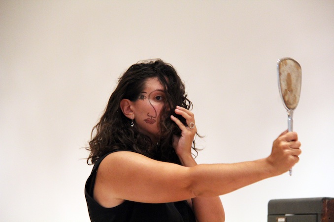 This is a still of me performing our show All The Things I've Lost, at the Gardiner Museum. This show was heavily influenced by my mother, grandmother and daughter (who was two at the time). My mom performed the show with me.