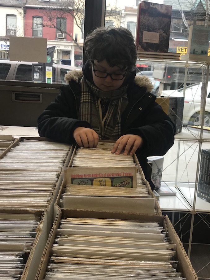 8. Flipping through old comics at our favourite hangout, The Beguiling, with my oldest son.