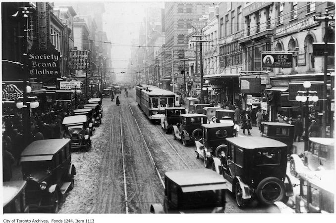 1924 - December 24 - Noon hour traffic, Yonge Street looking north from King Street