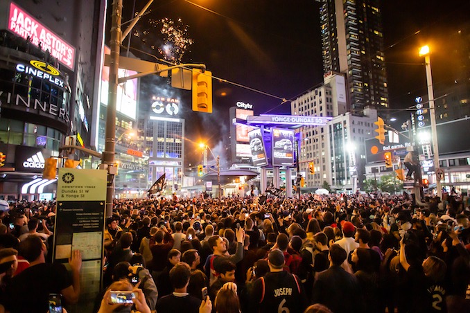 Raptors fans celebrate win at Yonge and Dundas Square. Photo by Joel Levy