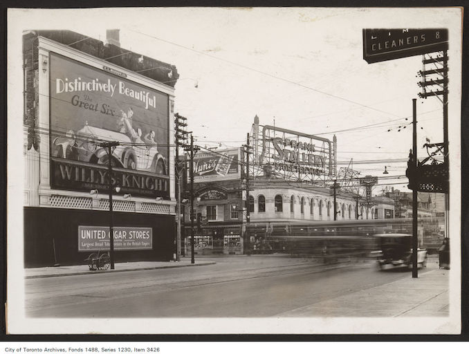 1929 - south-east and south-west corners of Yonge and Bloor streets. View is looking south-west. Willys-Knight Great Six Motor Cars - Hunt's Limited Candies and Ice Cream - Frank Stollery Store for Men