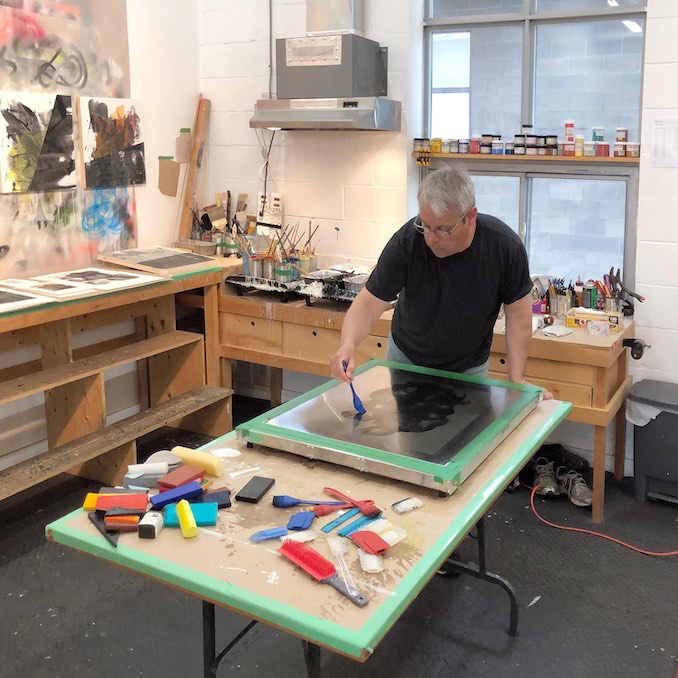 Here I am making an Encaustic Monotype.  The coloured beeswax paint is melted on a heated surface.  The molten wax is then manipulated with silicone tools to create lines and textures.  Once the composition is complete absorbent paper is placed on top of the plate and the image is transferred to the paper.
