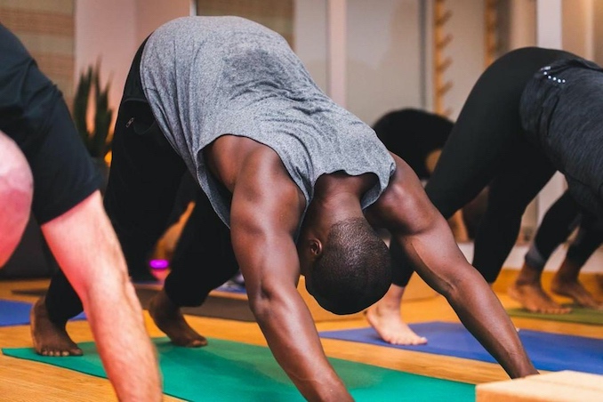 Practicing hatha yoga at Culture Athletics in Toronto.