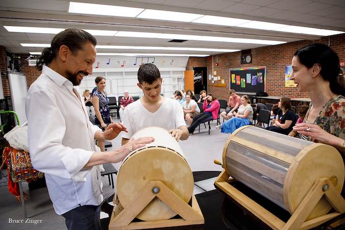 Co-Artistic Director Marshall Pynkoski demonstrates a wind machine to a student from the Blind and Partially-Sighted community in Opera Atelier’s Making of an Opera program.