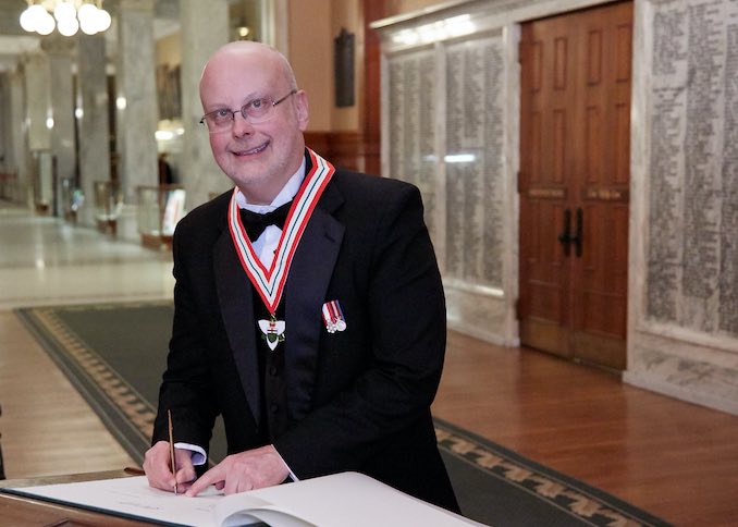 The boy cleans up nice! Here I am signing the official registry at Queen’s Park after being inducted into the Order of Ontario.