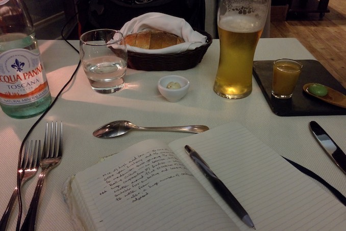 My usual view at a restaurant. If I’m not dining with someone, then I’m sharing the table with my notebook.