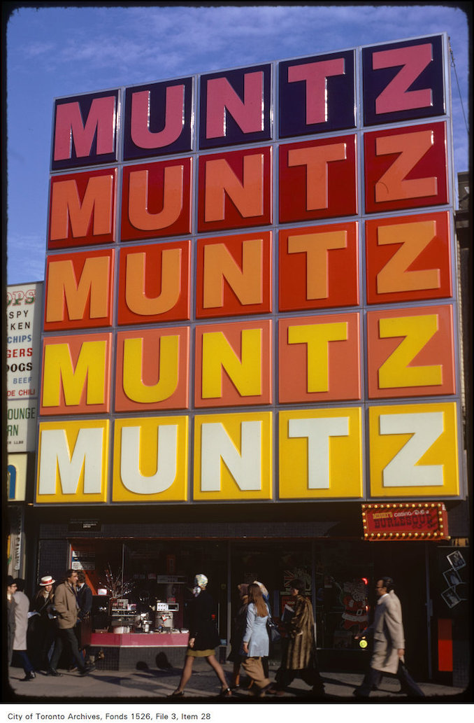 1973 - Close view of storefront Muntz on east-side of Yonge Street, north of Dundas