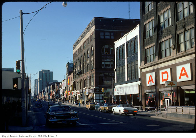 1975 - View of shops on the east side of Yonge Street, north of Albert Street