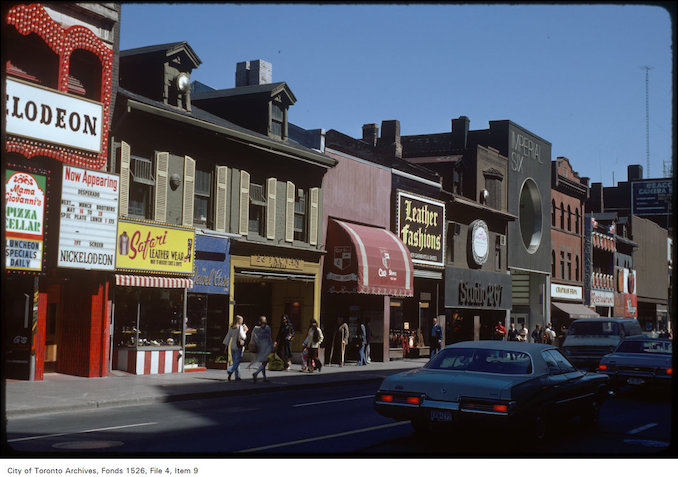 1977 - View of stores on the east side of Yonge Street, south of Dundas Street