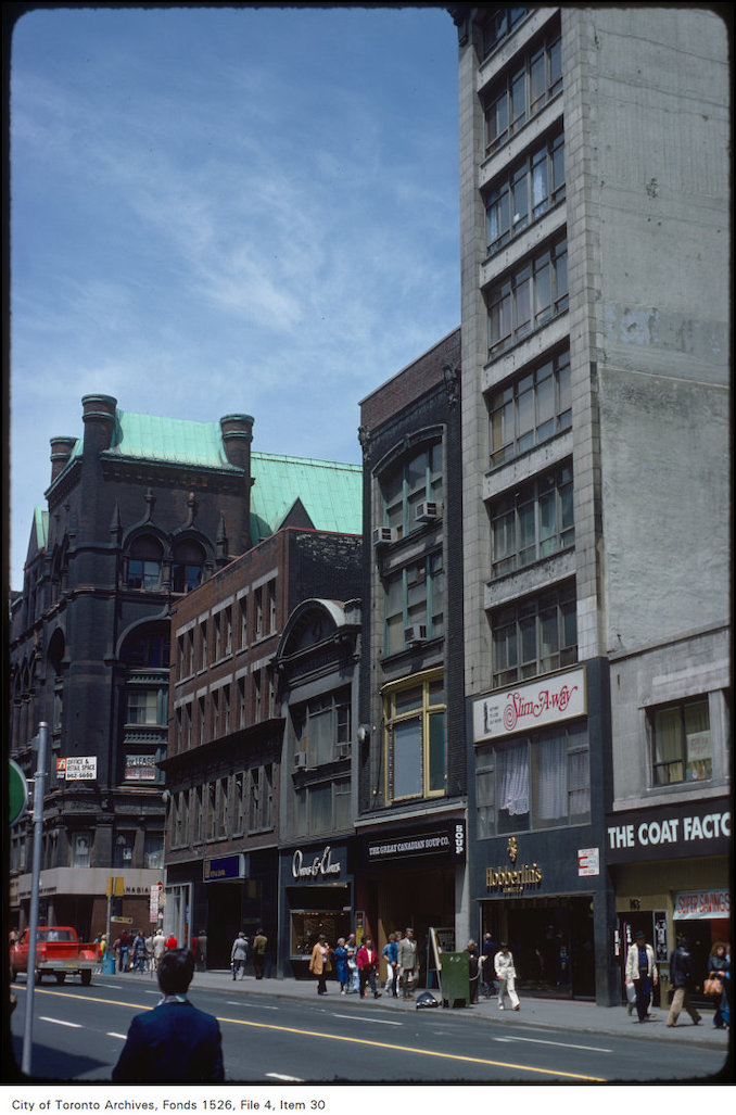 1977 - View of stores on the east side of Yonge Street, south of Richmond Street