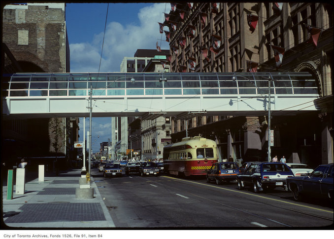 1979 - View of pedestrian walkway, Simpson's and traffic at Yonge and Queen Street