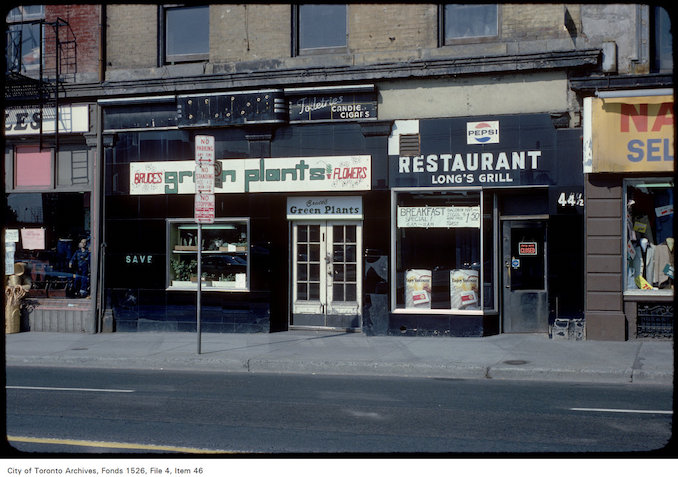 1979 - View of shops on the west side of Yonge Street, south of Wellington