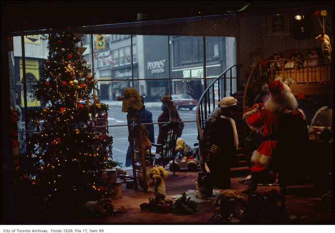 1983-December 24-Interior view of Christmas display in Simpsons looking out onto street