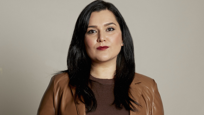 Head shot of Fazilla Amiri in a brown leather jacket