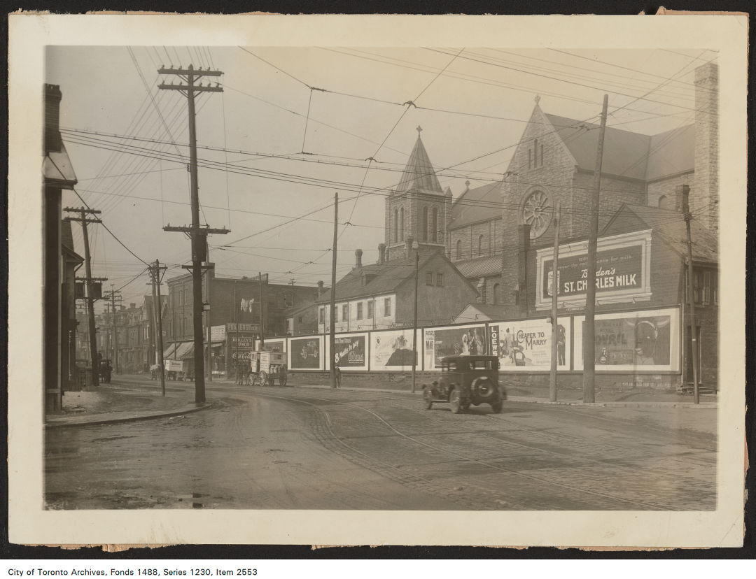 1920 - 1926 - photograph of a painted wall advertisement on the side of a building located at the north-west corner of Dundas Street West and St. Patrick Street.