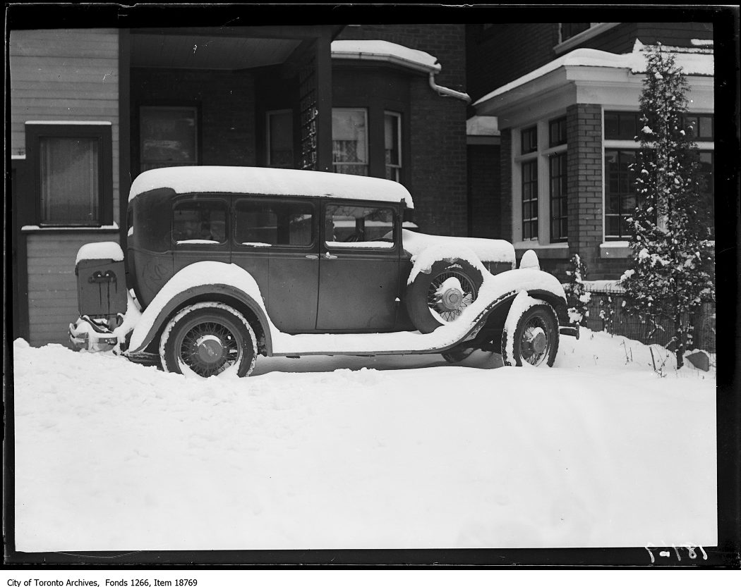 1929 - Car in yard covered with snow
