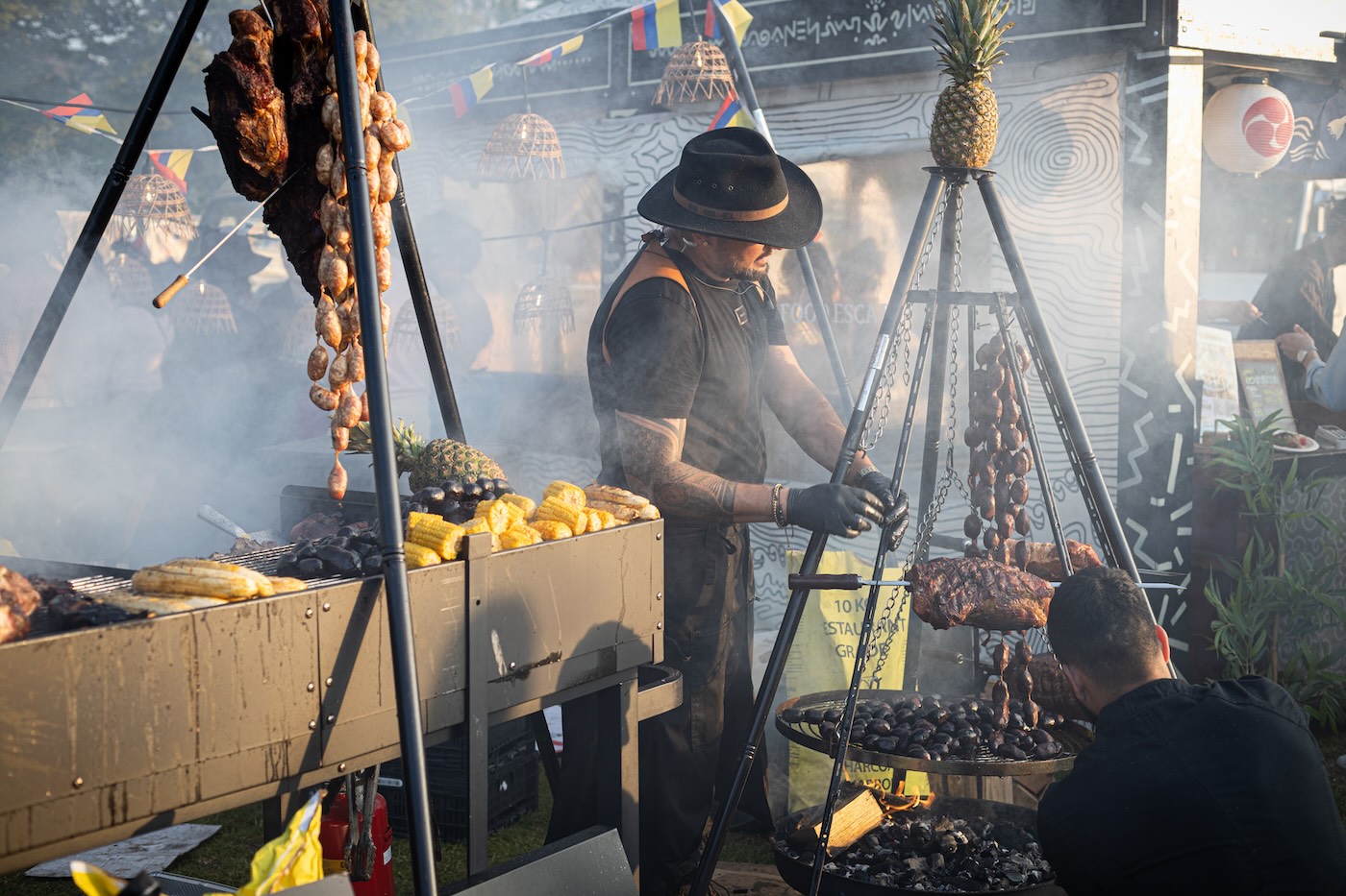 Man barbecuing meat at the Rollende Keukens - Photo by Joel Levy