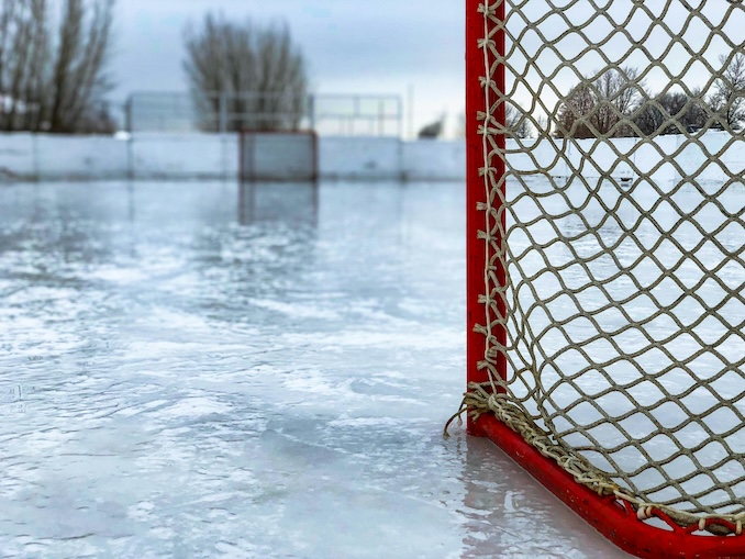 hockey net on the ice outdoors.