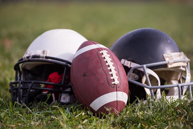 football and 2 helmets