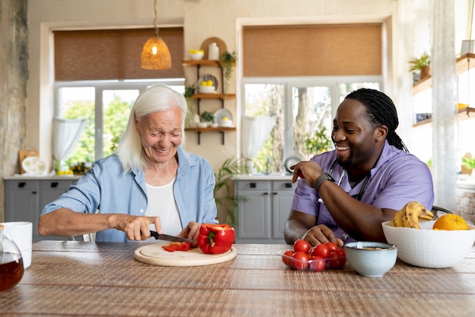 Old women and middle aged man eating together.