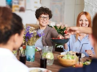 Middle aged women sharing a meal over a dinner table for the featured image