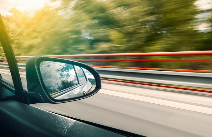 Car window shot in passenger seat looking out.