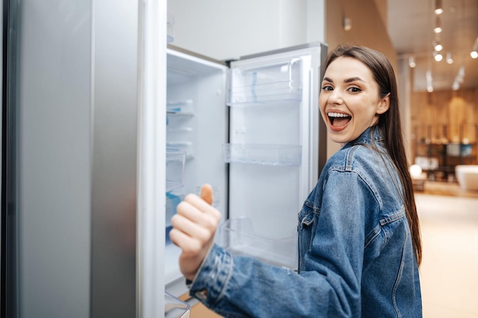 Woman opening a refrigerator