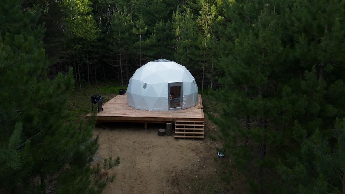 photo of a dome in a wooden area used for glamping near ottawa