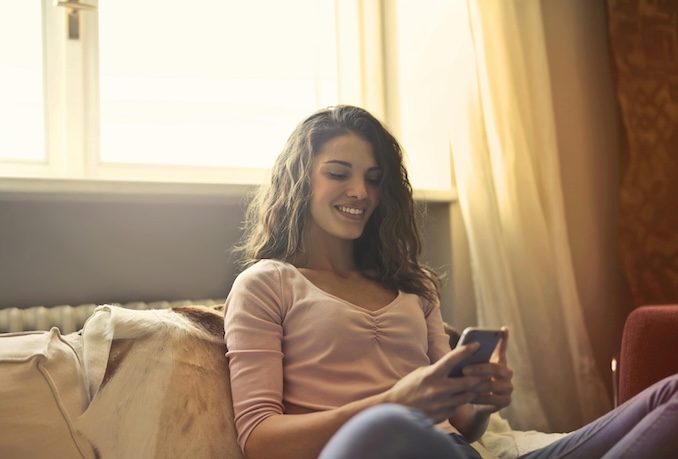 woman texting on her cell phone