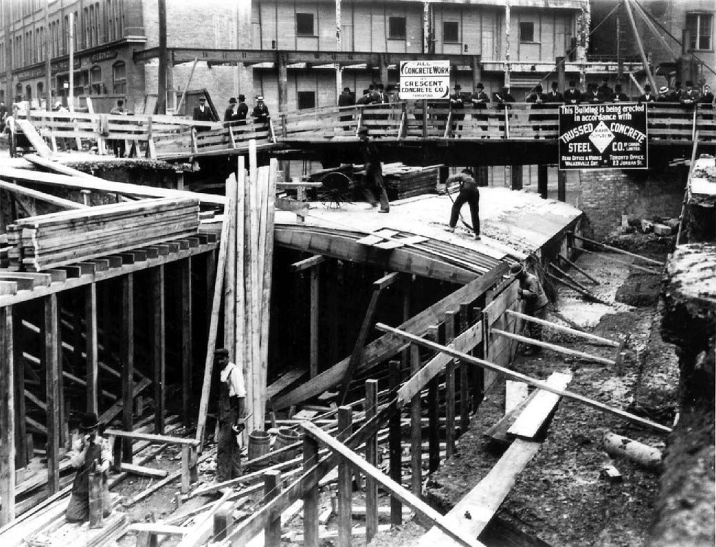 Toronto's first public pedestrian tunnel under construction c. 1900. The tunnels connected the buildings of the Eaton's Annex